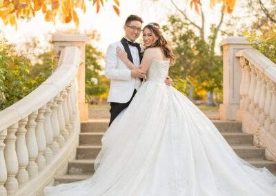 CineCrown wedding bride and groom posing for a photo in the fall.